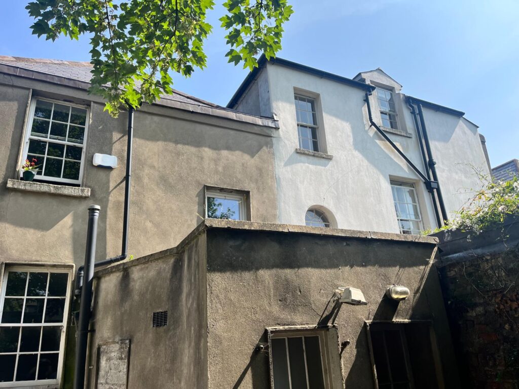 Restored Georgian home exterior after professional wall cleaning and coating in Dublin by UEH Ireland, showcasing clean, crack-free walls and fresh paint.
