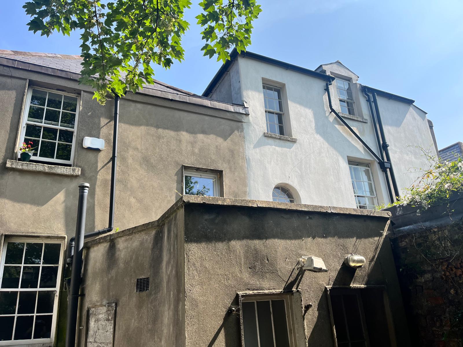 Restored Georgian home exterior after professional wall cleaning and coating in Dublin by UEH Ireland, showcasing clean, crack-free walls and fresh paint.