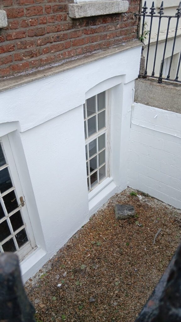 property transformed through expert wall cleaning and coating in Dublin, revealing dramatic improvement in surface condition and appearance.