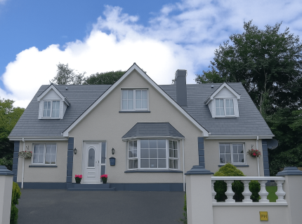 Front of large home after wall and roof cleaning by UEH Ireland